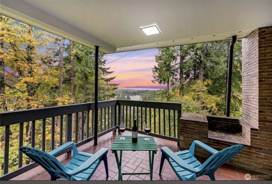 Covered deck with sunset water view